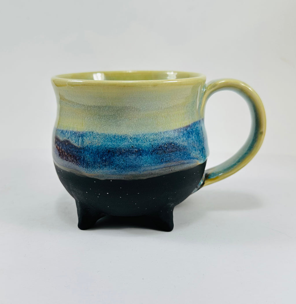 handmade cauldron mug in a beautiful green and blue glaze