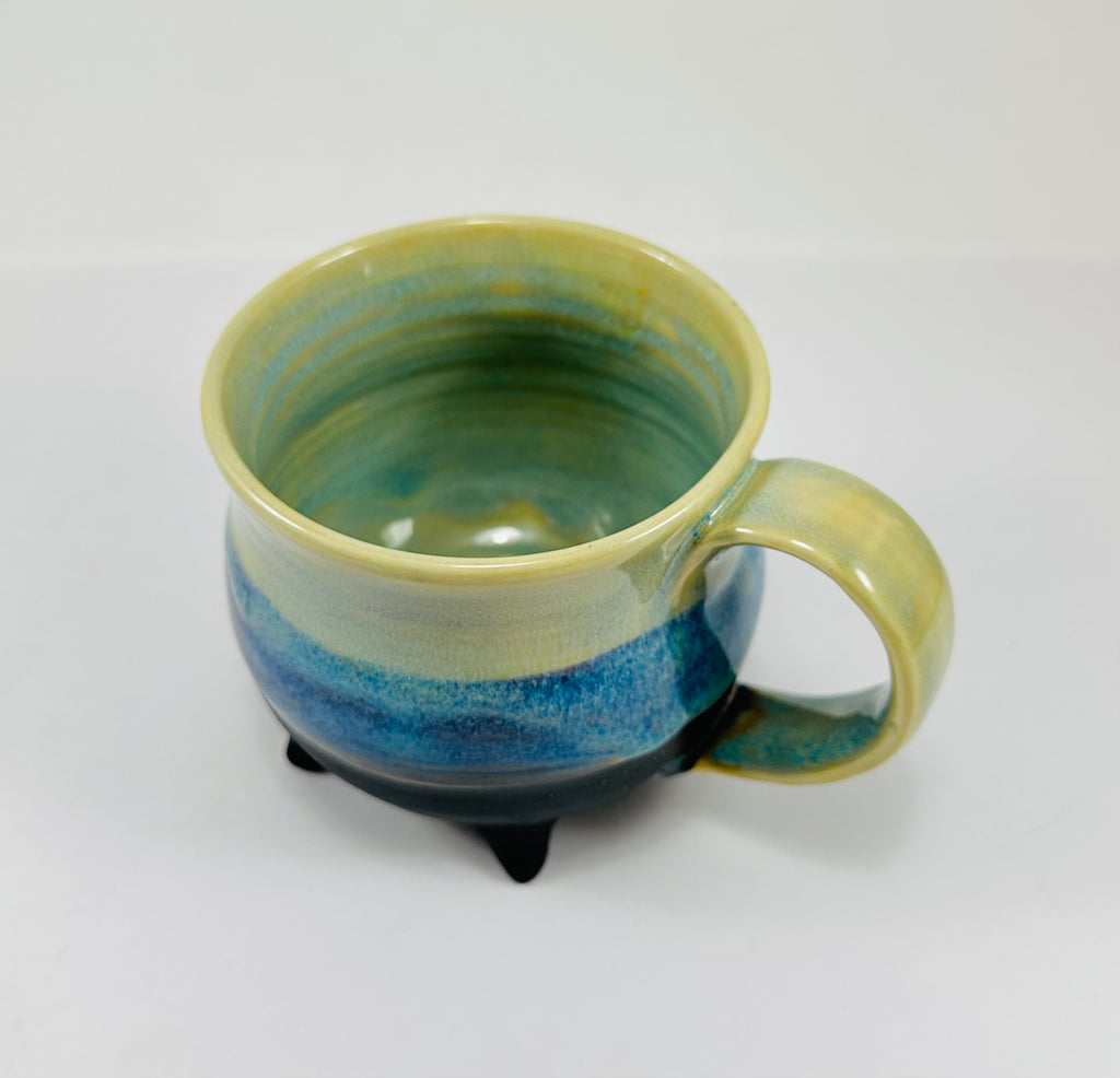 handmade cauldron mug in a beautiful green and blue glaze