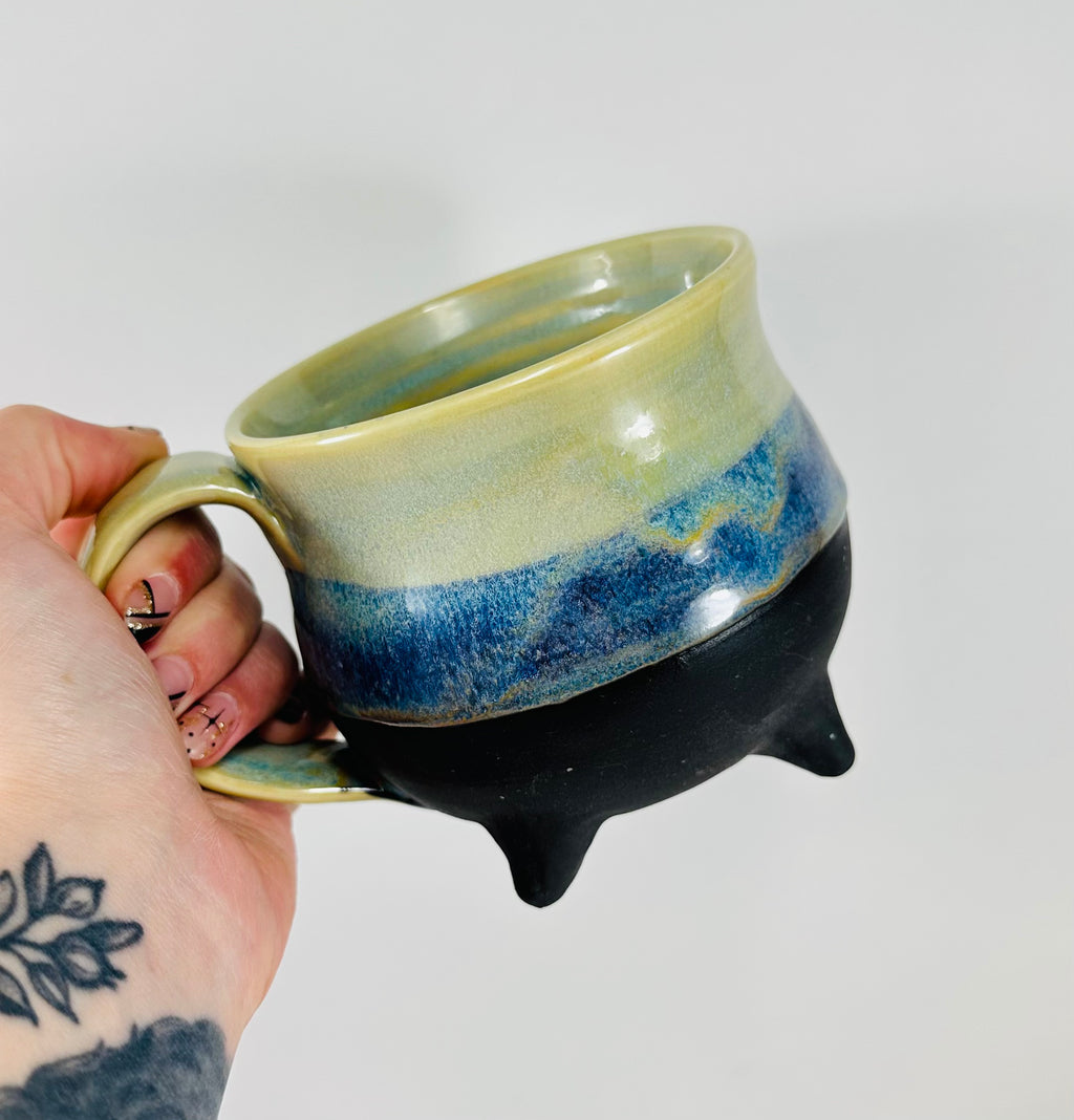 handmade cauldron mug in a beautiful green and blue glaze